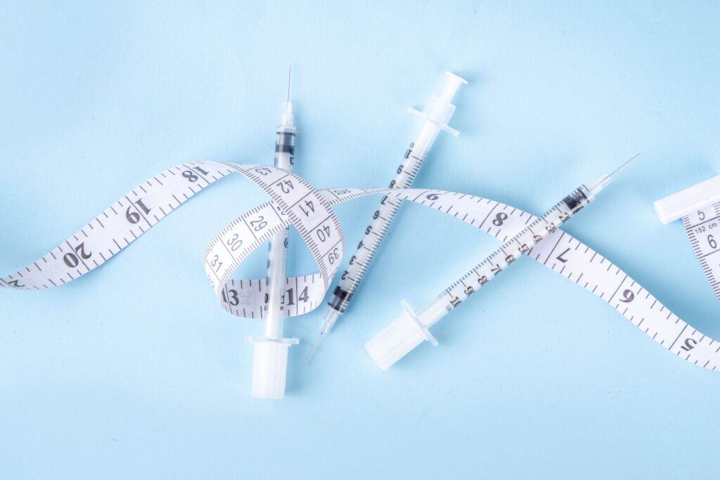 measuring tape and syringe