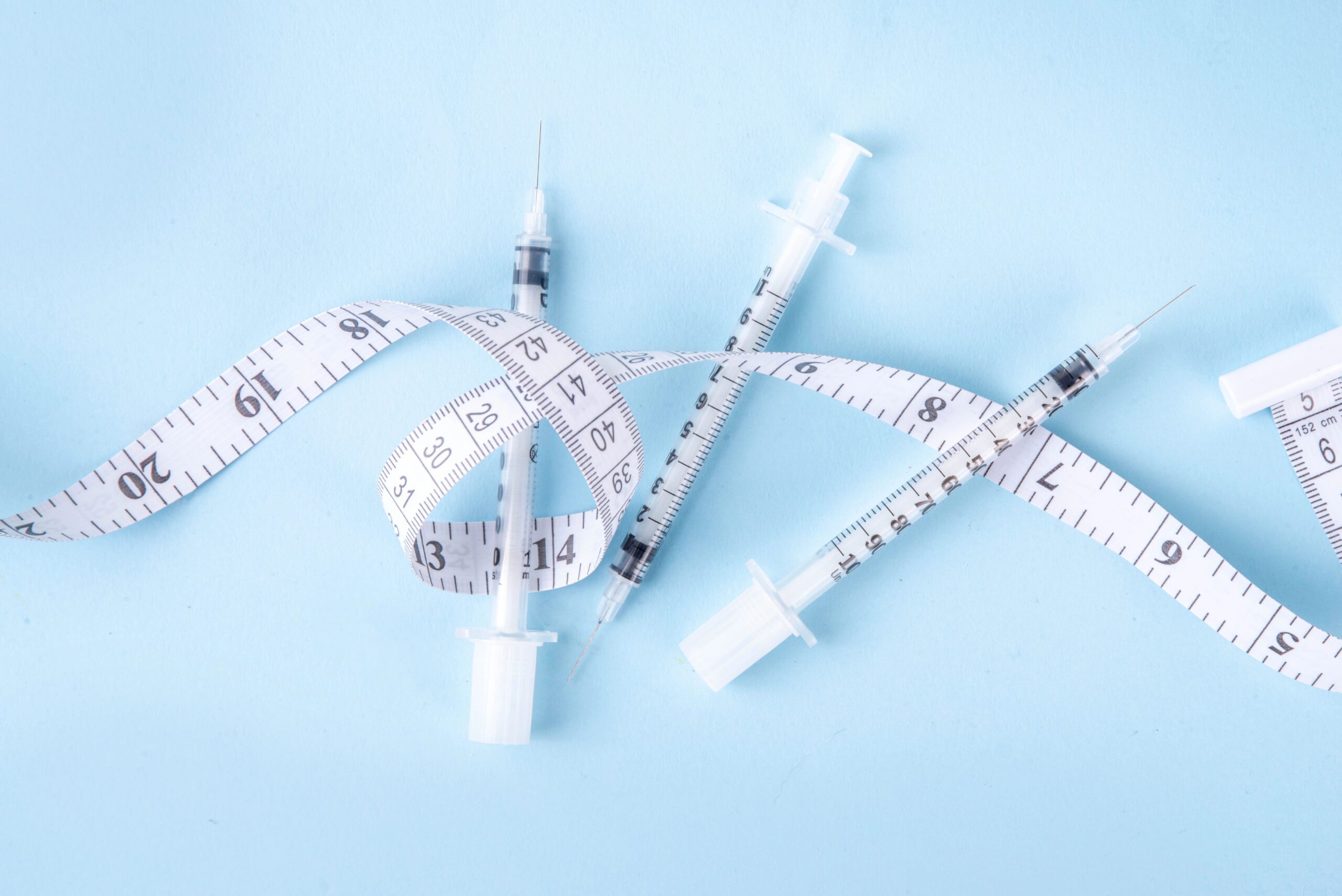 measuring tape and syringe