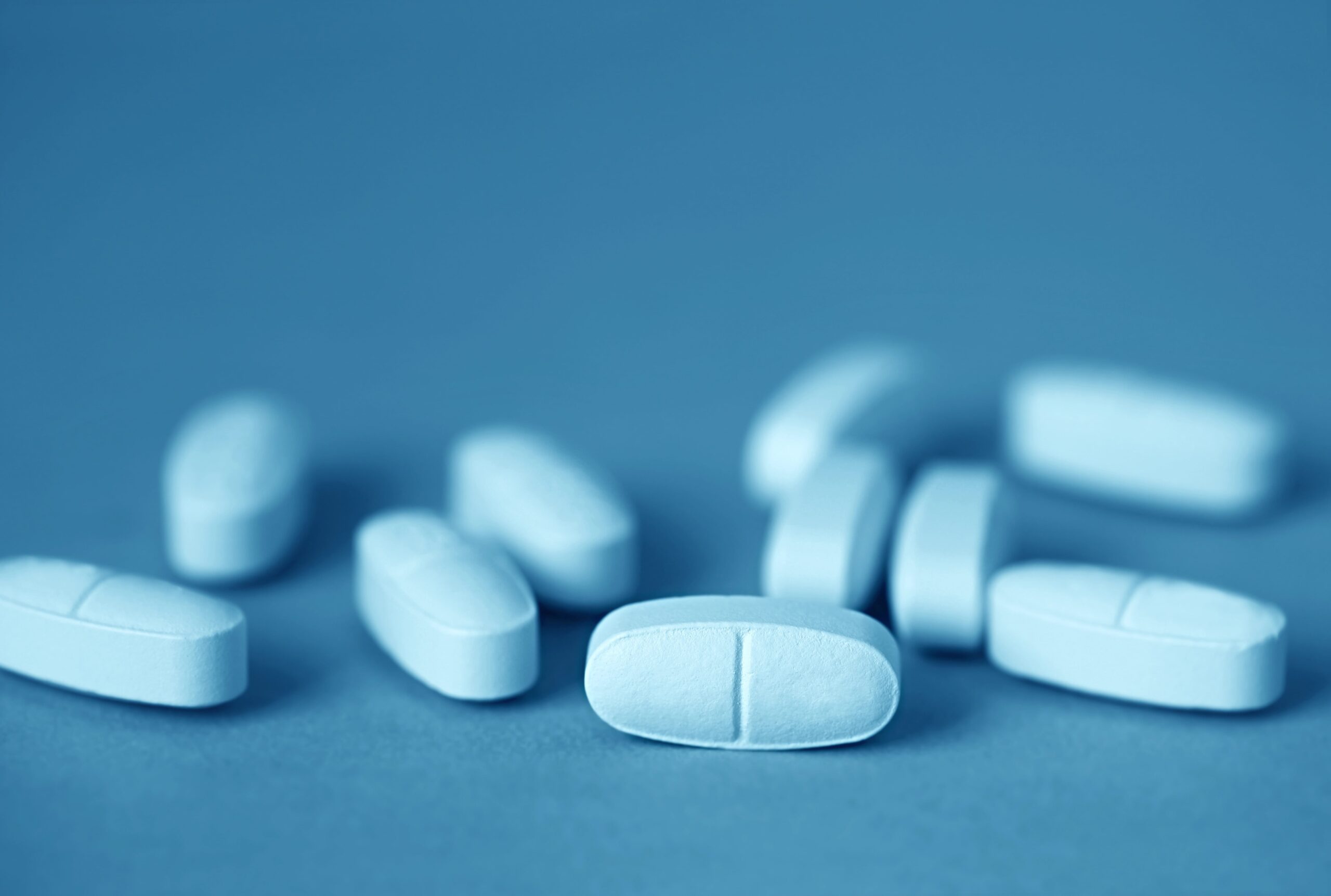 Pills on blue background